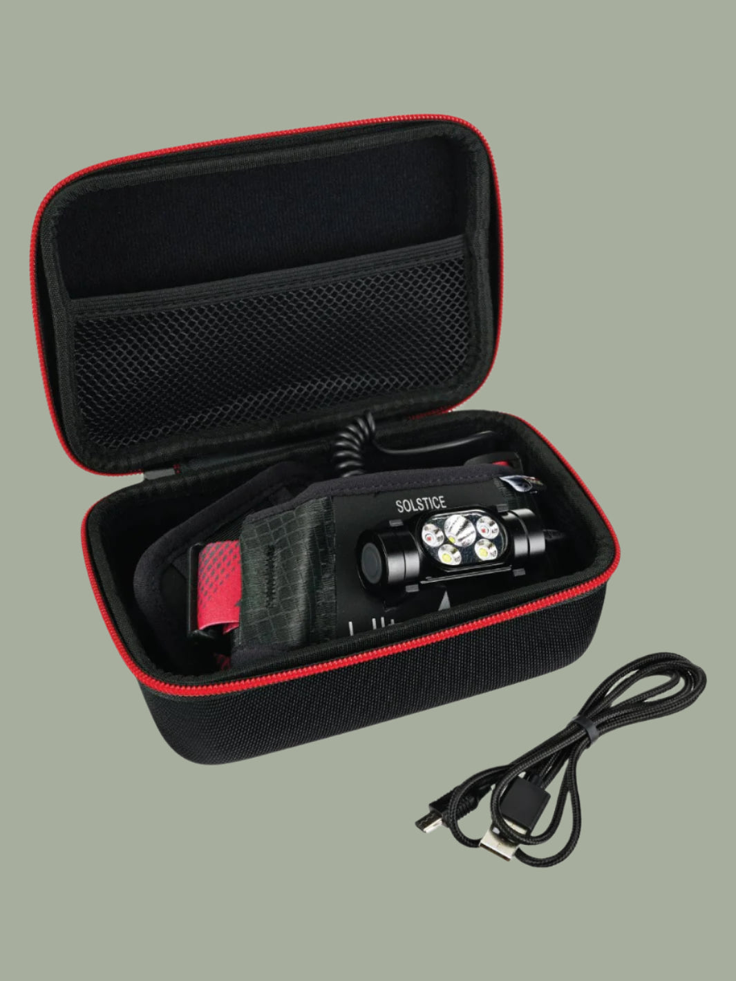 Black and red carrying case with a flashlight and cable on a white background